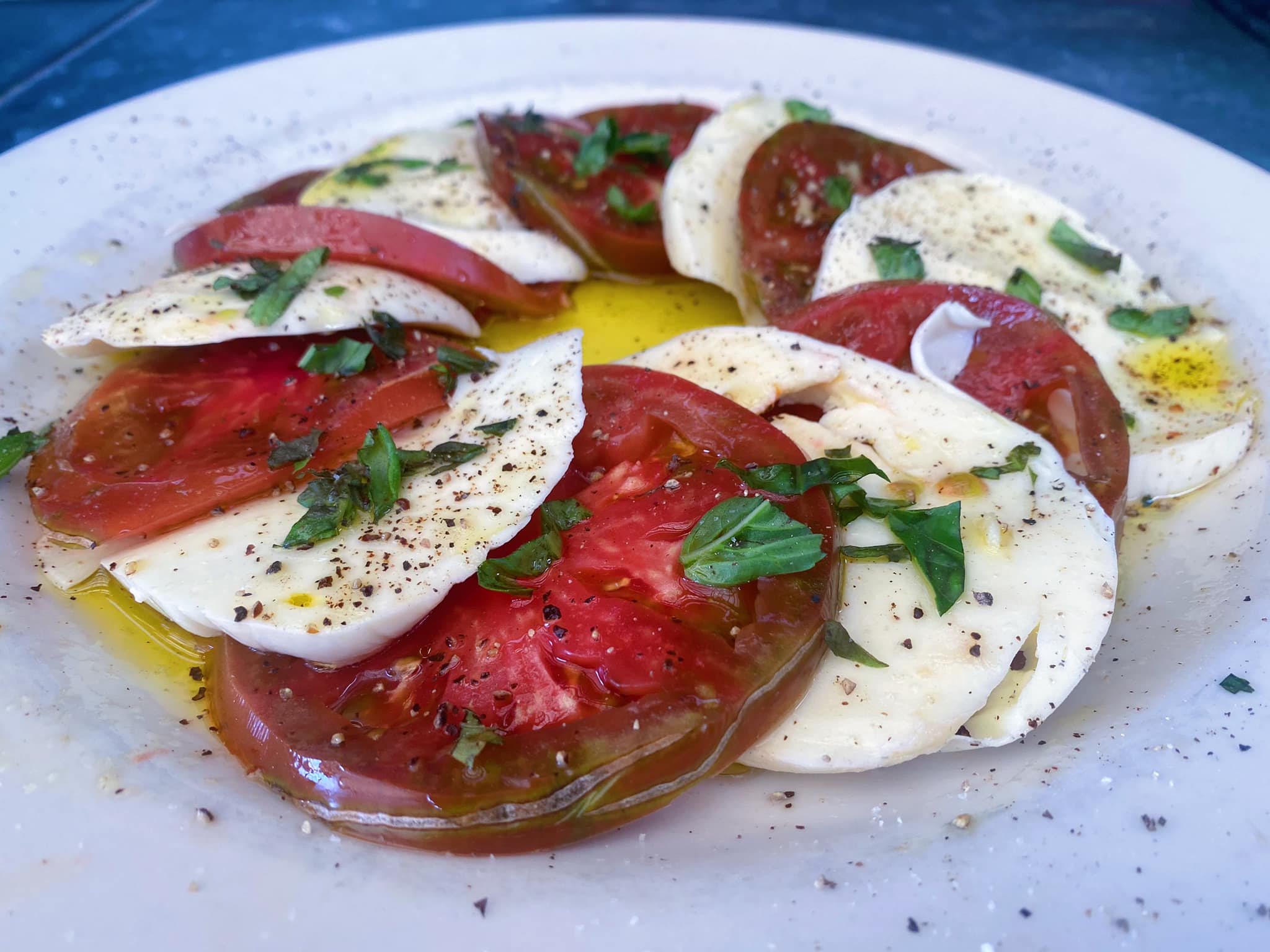 An insalata caprese made with heirloom tomatoes.