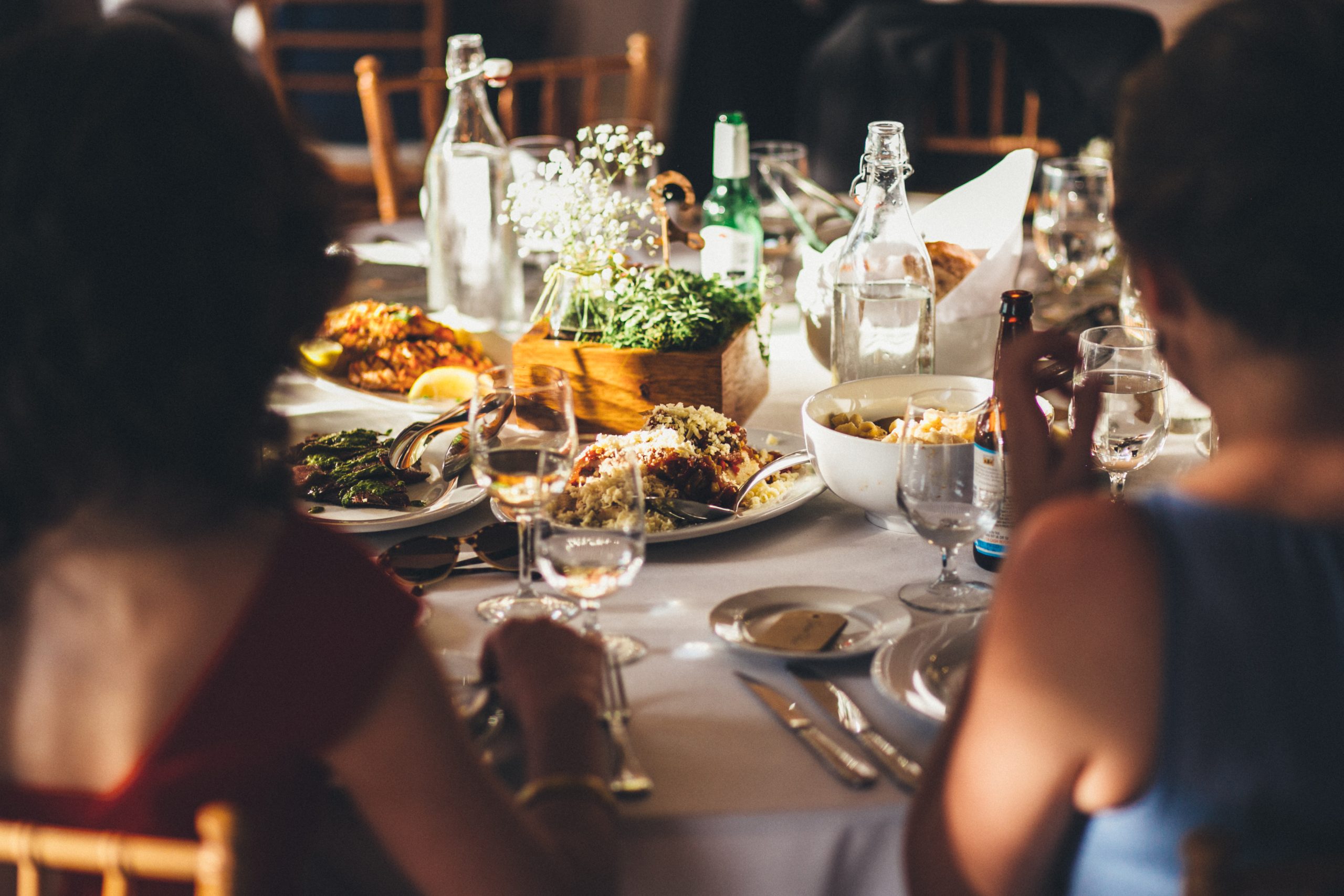 Wedding guests dining at a formal table.