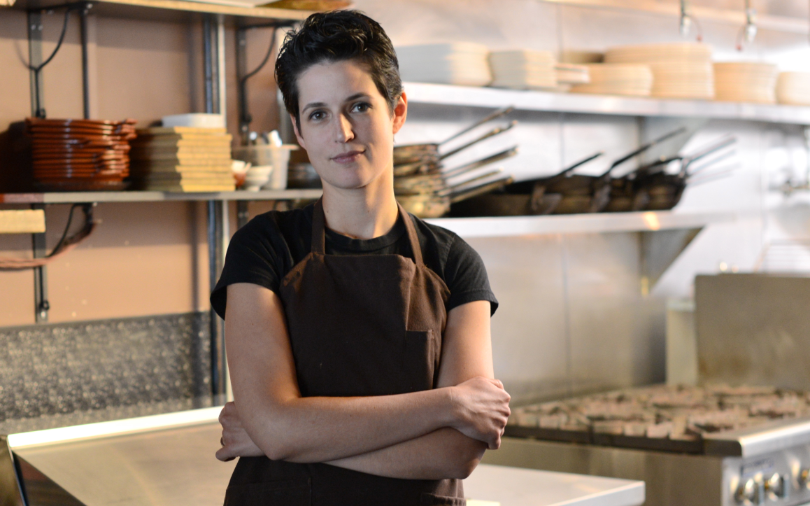 A photo of Chef Bonnie Morales standing in her kitchen at Kachka