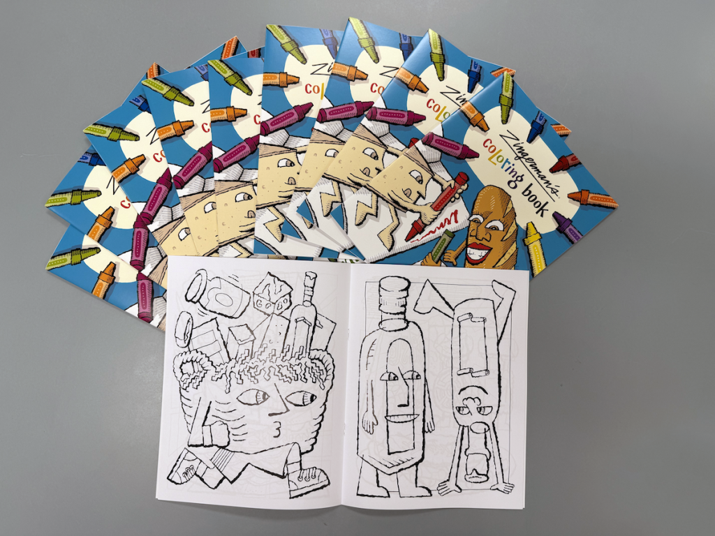 A pile of Zingerman's coloring books spread out in a fan, with one opened up to reveal two of the illustrations.