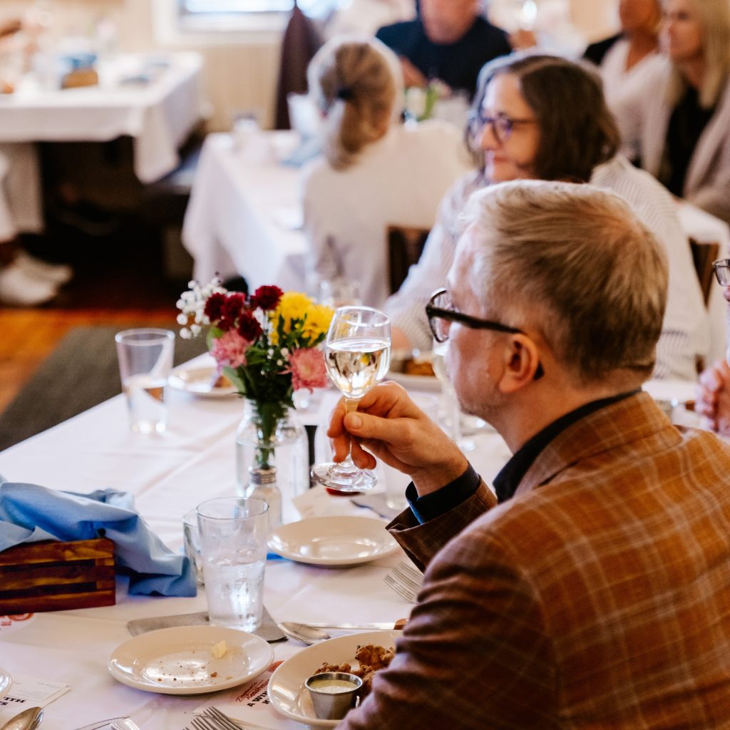 Man holding glass for toast
